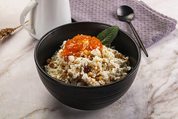 Curd with granola and orange jam