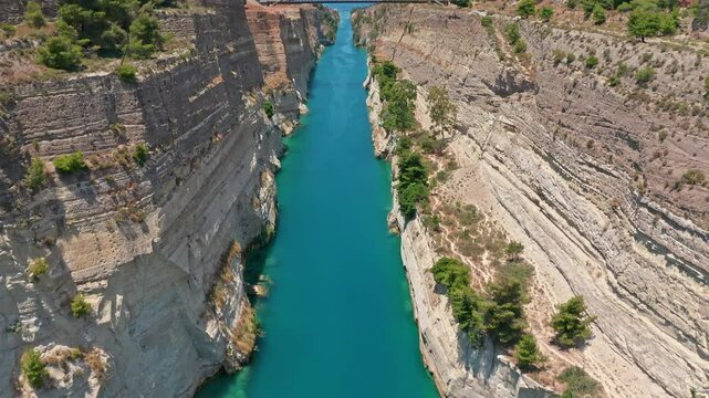 Passage of Corinth canal in Greece. Flying over cliffs and rocks