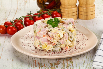 Russian traditional Olivier salad with sausages