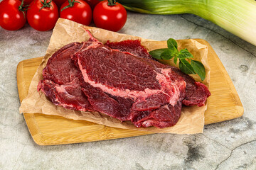 Raw beef cheeks cut for cooking