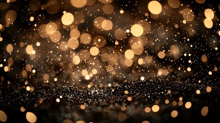 Sparkling Bokeh Glittering gold bokeh lights above tiny granules on a dark background