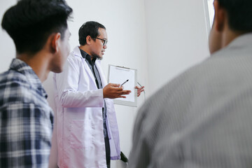 Fototapeta premium Front View Of Therapist's Hands Explaining Problem To His Patients