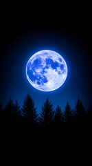 Fototapeta premium Enormous blue moon rises above dark silhouetted pine trees at night
