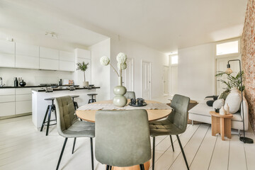 A sleek and contemporary living space featuring a stylish dining area, ergonomic furniture, and elegant decor that emphasizes simplicity and functionality.