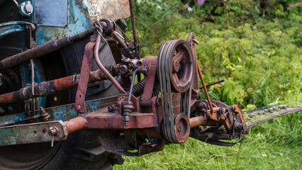 Rural tractor mowing grass with tractor mower