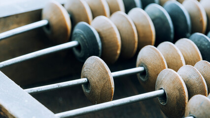 Vintage abacus on a wooden background