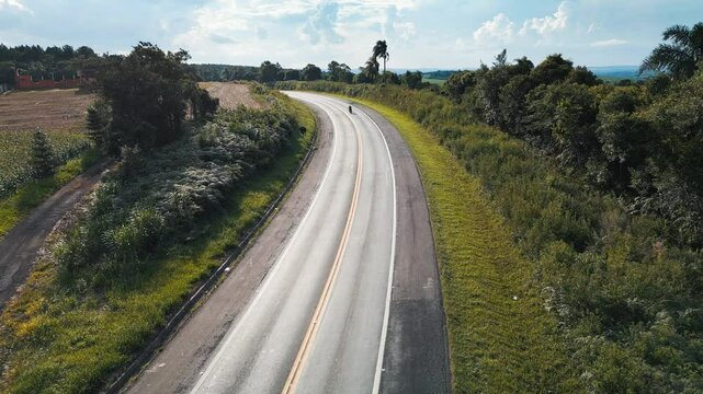 Aerial view of the highway BR277 with cars and trucks moving on it. State of Parana, Brazil