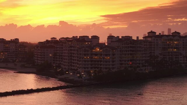 An aerial shot captures the stunning essence of South Pointe Pier and Fisher Island at sunset, showcasing Miami Beachs coastal charman unforgettable scene for relaxation and adventure