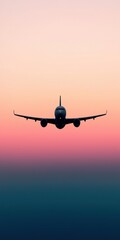 Fototapeta premium Airplane flying into a colorful sunset sky