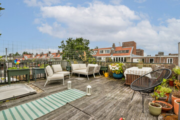 An inviting roof terrace featuring comfortable seating, potted plants, and a modern design, perfect...