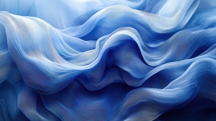 Fototapeta premium A close-up of flowing blue fabric, showcasing soft textures and gentle waves that create an elegant and serene visual appeal.