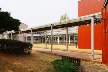 A photograph of a building’s colonnade, showcasing its architectural elegance and rhythmic...