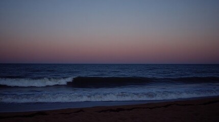 Fototapeta premium Serene Twilight Seascape Pink And Purple Sunset Over Dark Ocean Waves