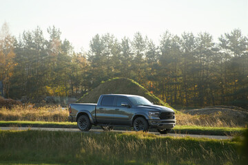 Fast pickup truck driving on open road