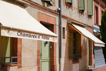A sunshade of a house with the French text Chambres d'Hôtes in Portet-sur-Garonne Southern France. Chambres d'Hôtes is the french version of Bed and Breakfast.