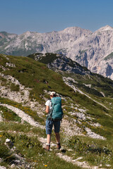 Fototapeta premium Mountaineer hiking on early morning, Triglav National Park, Slovenia
