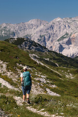 Naklejka premium Mountaineer hiking on early morning, Triglav National Park, Slovenia