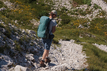 Mountaineer hiking on early morning, Triglav National Park, Slovenia