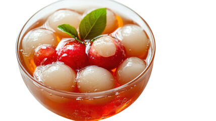 Refreshing dessert with colorful fruit balls in sweet syrup served in a clear bowl