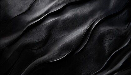 Fototapeta premium Deep black and charcoal gray blurred texture creating a smooth, luxurious, and elegant dark background