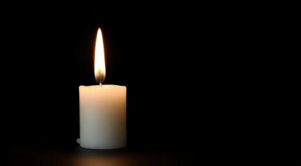 Single Candle in Dark Room