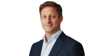 Professional man in business attire poses confidently against a neutral background in a corporate setting