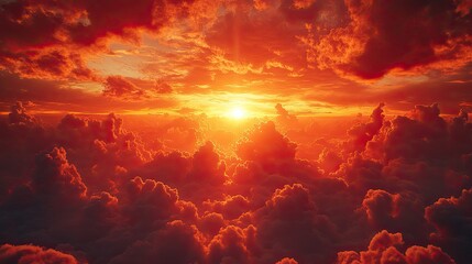 Dramatic sunset sky filled with billowing clouds illuminated in vibrant shades of orange,