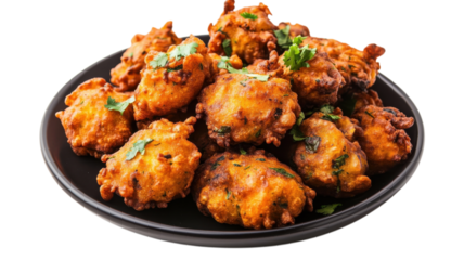 Delicious spicy fritters served on a black plate garnished with fresh herbs ready to be enjoyed at a festive gathering