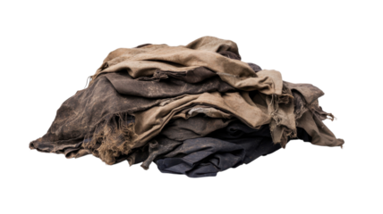 Old, worn fabrics piled together showing signs of heavy use and natural wear over time in a neutral setting