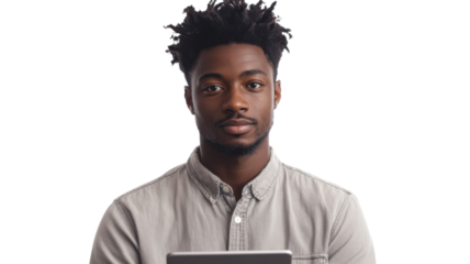 Young man with curly hair holds a tablet while looking confidently at the camera in a modern, bright setting