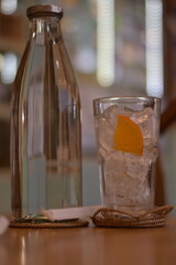 Water is poured into a glass filled with ice and lemon slices, Refreshing iced lemon drink in a rocks glass, Two shots of tequila with ice and lemon flat vector illustration, Glass of lemon-flavored b