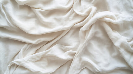 Soft white fabric with gentle folds and textured weave, perfect for minimalist backgrounds, textile design, and natural fabric concepts.
