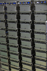 Close-up view of group of metal deep fryer cooking baskets standing in row one on another. Commercial kitchen background. Food and drink industry.