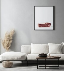 Raw steak artwork in minimalist living room.