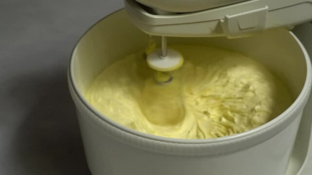 dough mixer machine is mixing nastar and kastengel cake dough. making cake dough