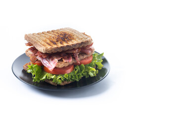Bacon sandwich with lettuce and tomato isolated on white background. Copy space