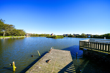View of the village pond in Wenningstedt and the surrounding nature. Landscape by the water on the...