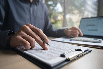 Fototapeta premium Accountant used a calculator financial analysis managing payroll tax accounting budget accounts.