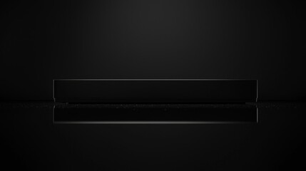 Fototapeta premium Sleek black device on dark background