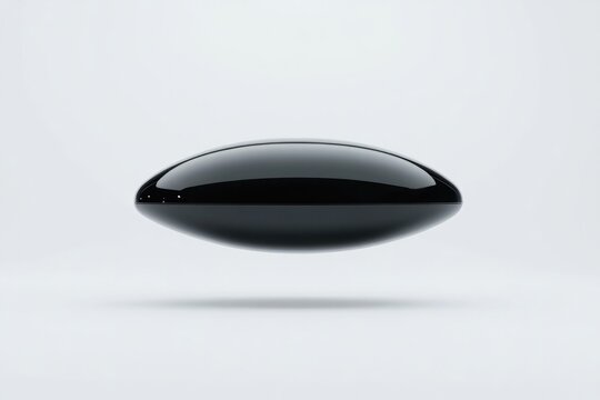 Sleek black shape hovers above minimalistic background, exuding