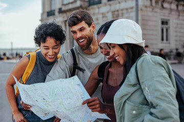 Happy tourists consulting a map in city center