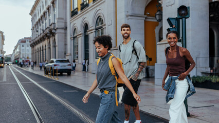 Tourists walking and crossing street in lisbon city center