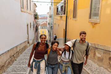 Group of tourists walking down a narrow street in lisbon, portugal