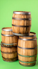 Stacked wooden barrels against a green background