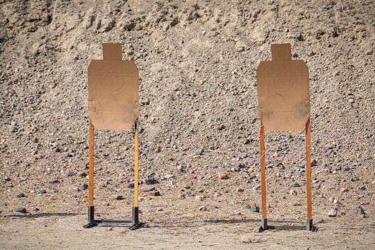 Cardboard targets ready for gun practice, outdoor shooting range in California