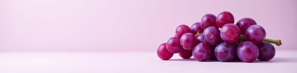 Minimalist composition of purple grapes on a plain white surface, grapes, fresh