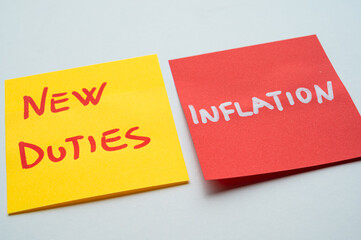 Colored sticky notes with the words new duties, inflation. New duties and economic and political consequences.