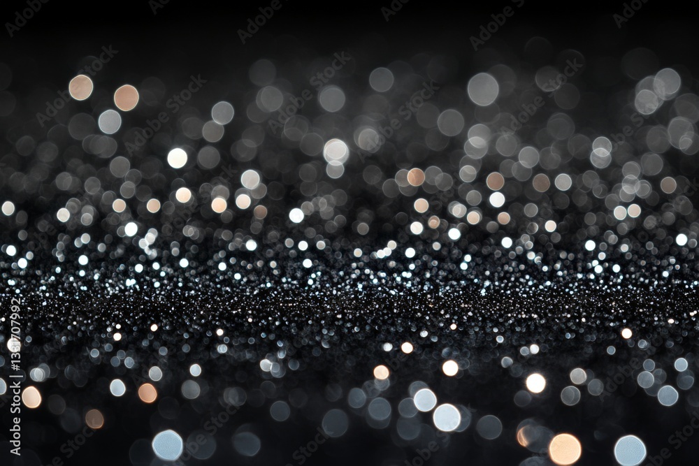 Poster Bokeh background with shimmering silver and gold particles against a dark surface, creating a festive and enchanting atmosphere
