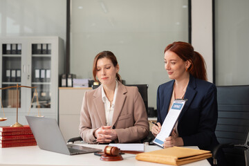Teamwork of business lawyer meeting working hard about legal legislation in courtroom to help their customer..