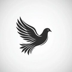 Fototapeta premium Elegant Black Bird Silhouette in Flight Against Gray
